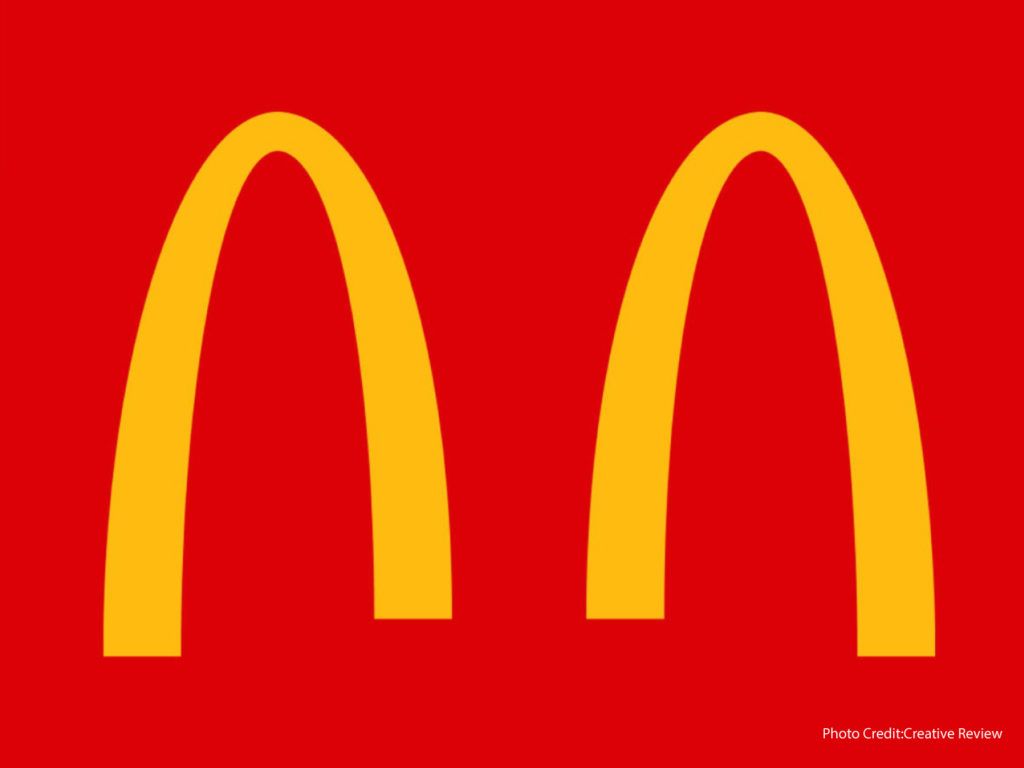 Mcdonald's spreads social distancing through a split logo